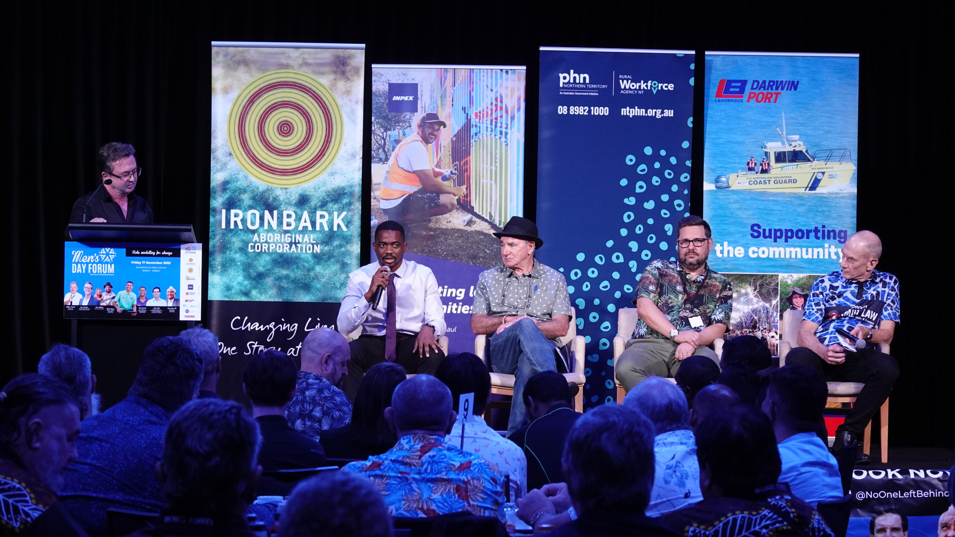 Joel on stage with audience
